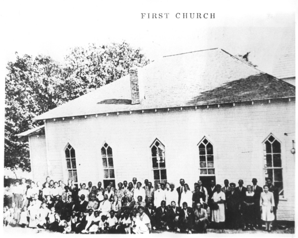 Group photo of the congregation of St. John Baptist Church in Mosier Valley in front of the church 